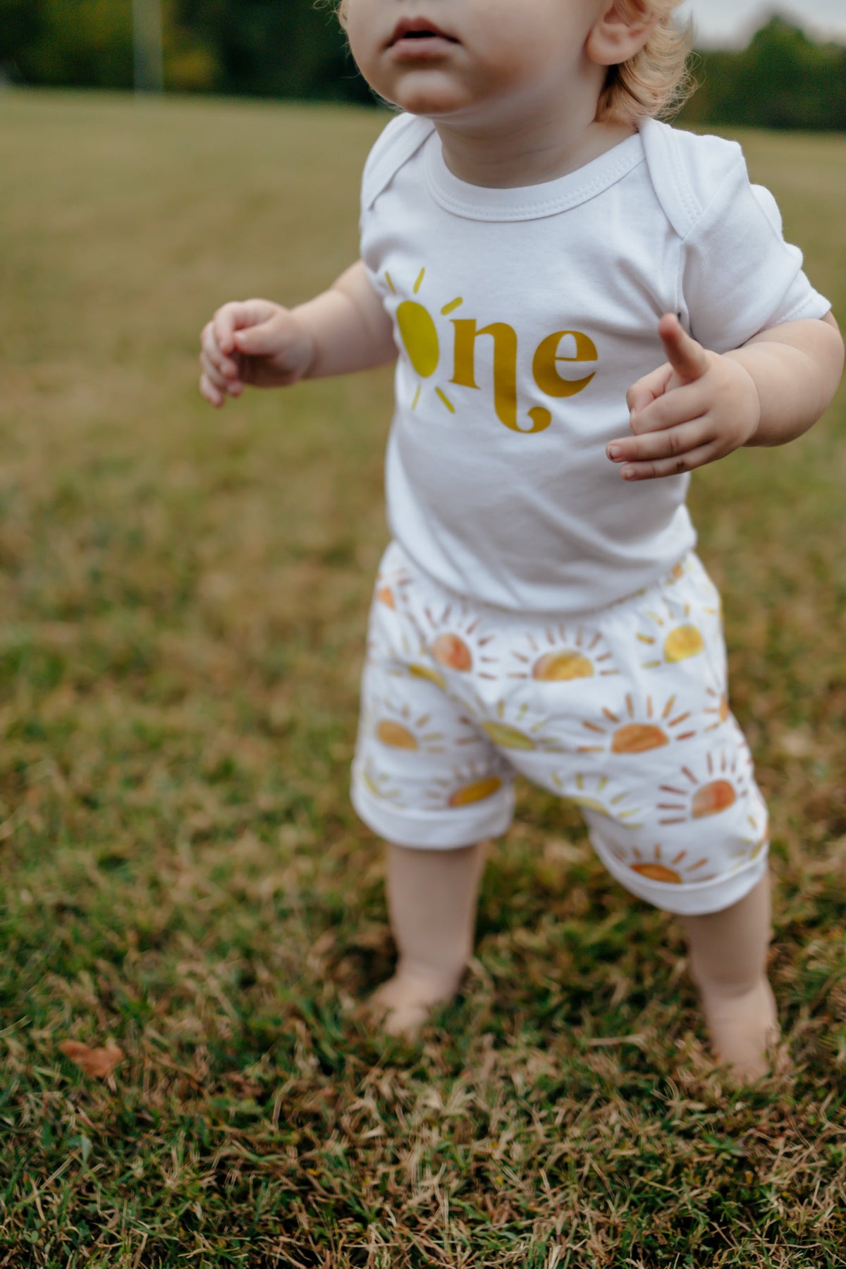Printify Graphic Tee Sun in One 1st Birthday Bodysuit
