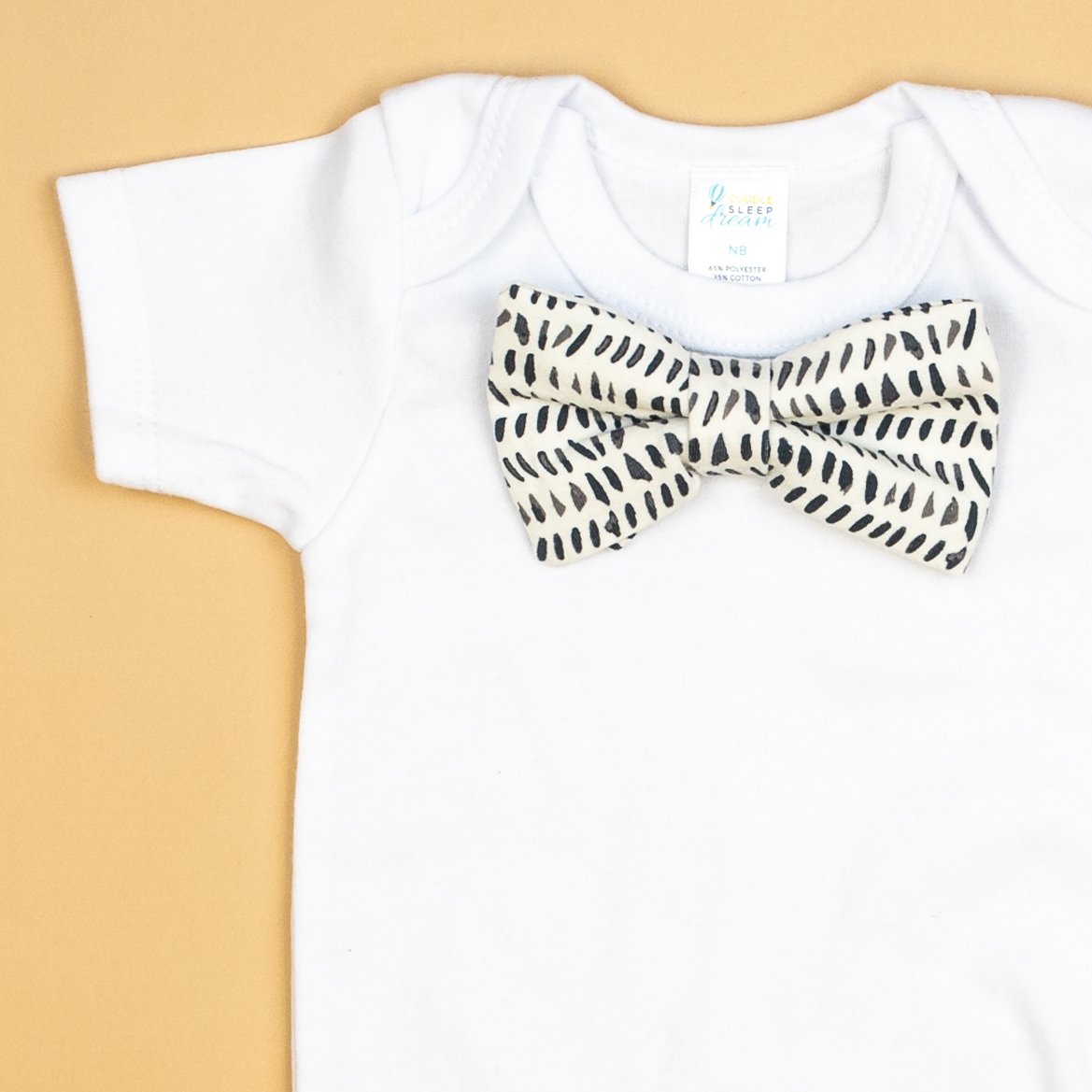 Cuddle Sleep Dream Bowtie Bodysuit Navy Dashes Bowtie Bodysuit